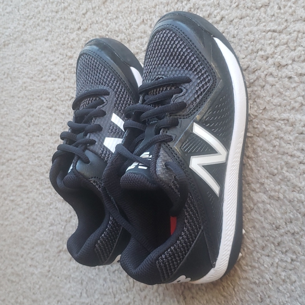 New Balance little kids cleats